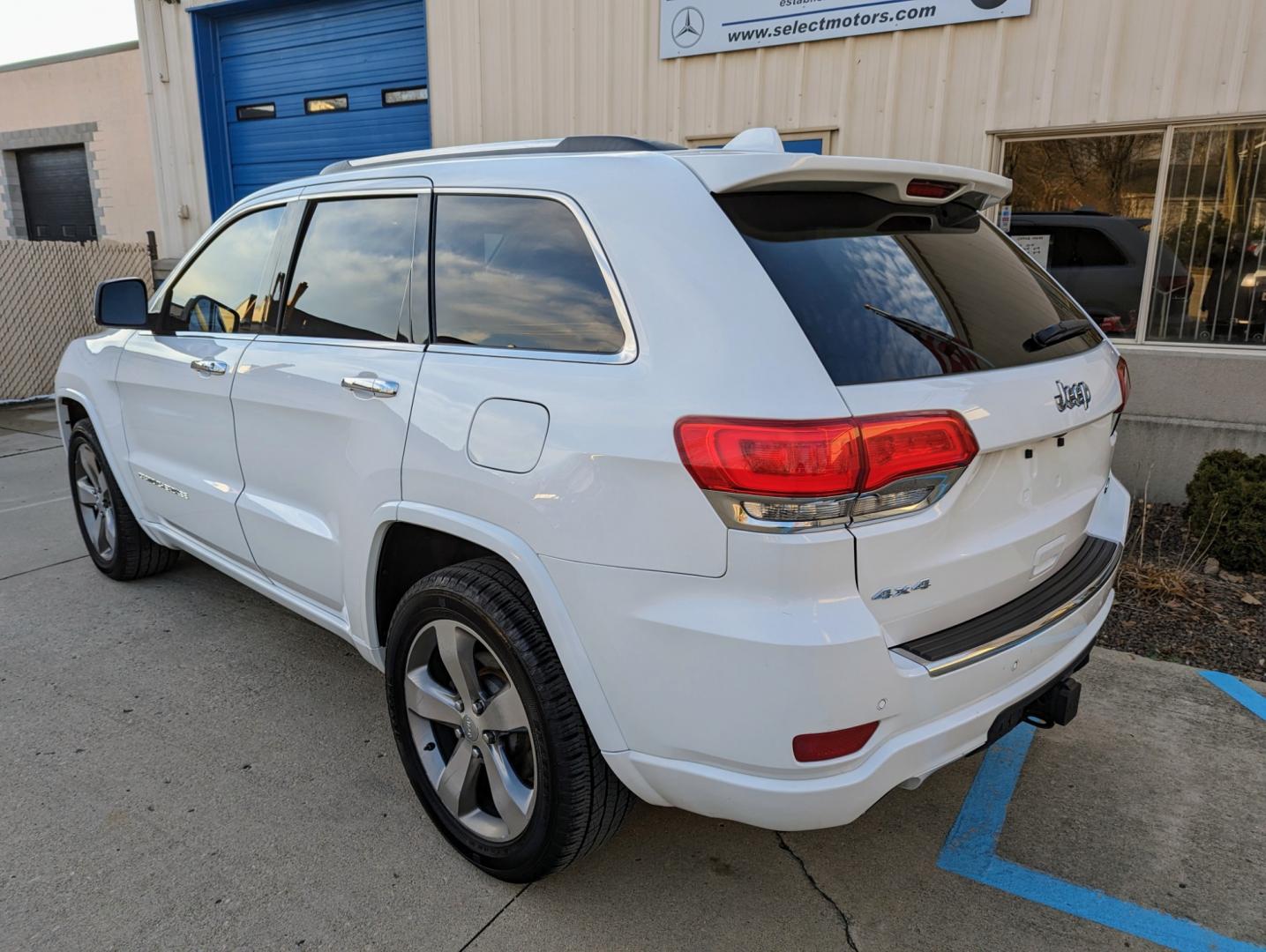 2014 White /Nepal Tan Jeep Grand Cherokee (1C4RJFCGXEC) with an 3.6L V6 DOHC 24V engine, Automatic transmission, located at 603 Amelia Street, Plymouth, MI, 48170, (734) 459-5520, 42.378841, -83.464546 - Vehicles shown by appointment - Please call ahead - 734-459-5520, text 734-658-4573 or contact us via our web site at: http://www.selectmotors.com for complete Inventory, Photos, Videos and FREE Carfax Reports. 2014 Jeep Grand Cherokee Overland, Bright White/Nepal Tan interior, 116K miles, all wh - Photo#2